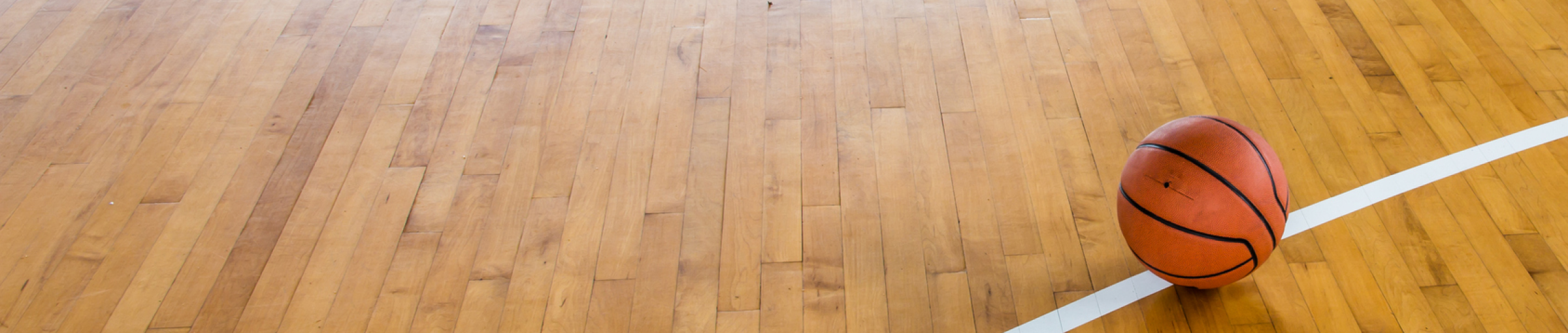 Image of basketball on indoor court