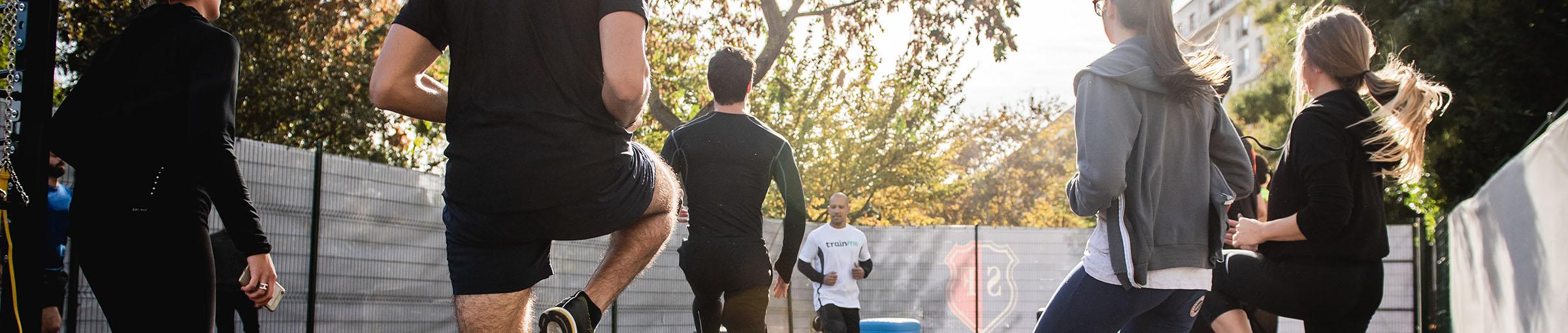 People working out as a group outside. 