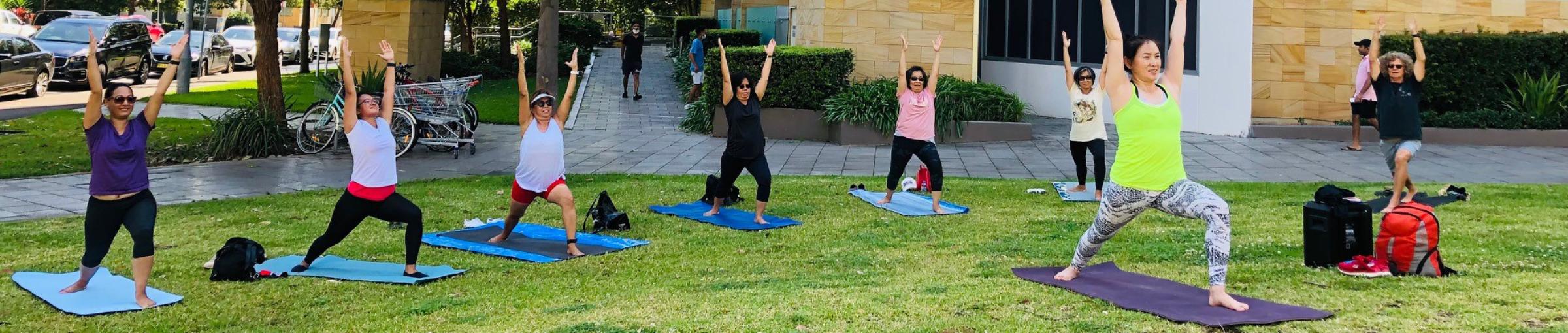 group yoga in park