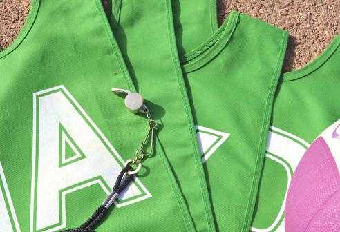 Green netball bibs and whistle